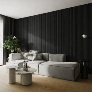 A minimalist interior featuring a tall vertical WPC radiator panel against a light-colored wall, alongside a green potted plant on a warm hardwood floor, evoking modern Scandinavian design and a sense of tranquility.
