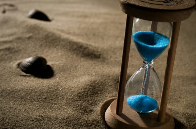 An hourglass with sand running through it