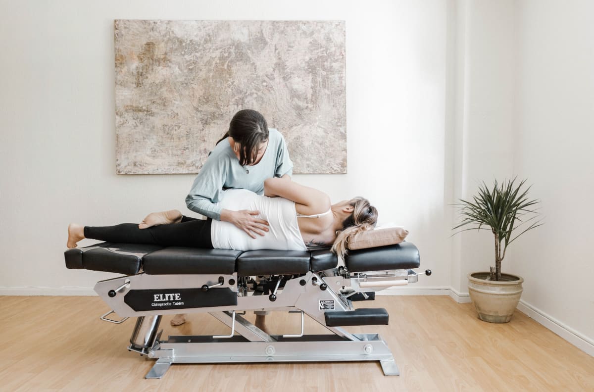 Chiropractic adjustment on the table at The Shift Chiropractic in Oakland