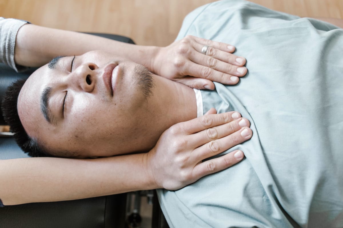 Manual chiropractic adjustment of neck and spine for pain relief at The Shift Chiropractic Oakland