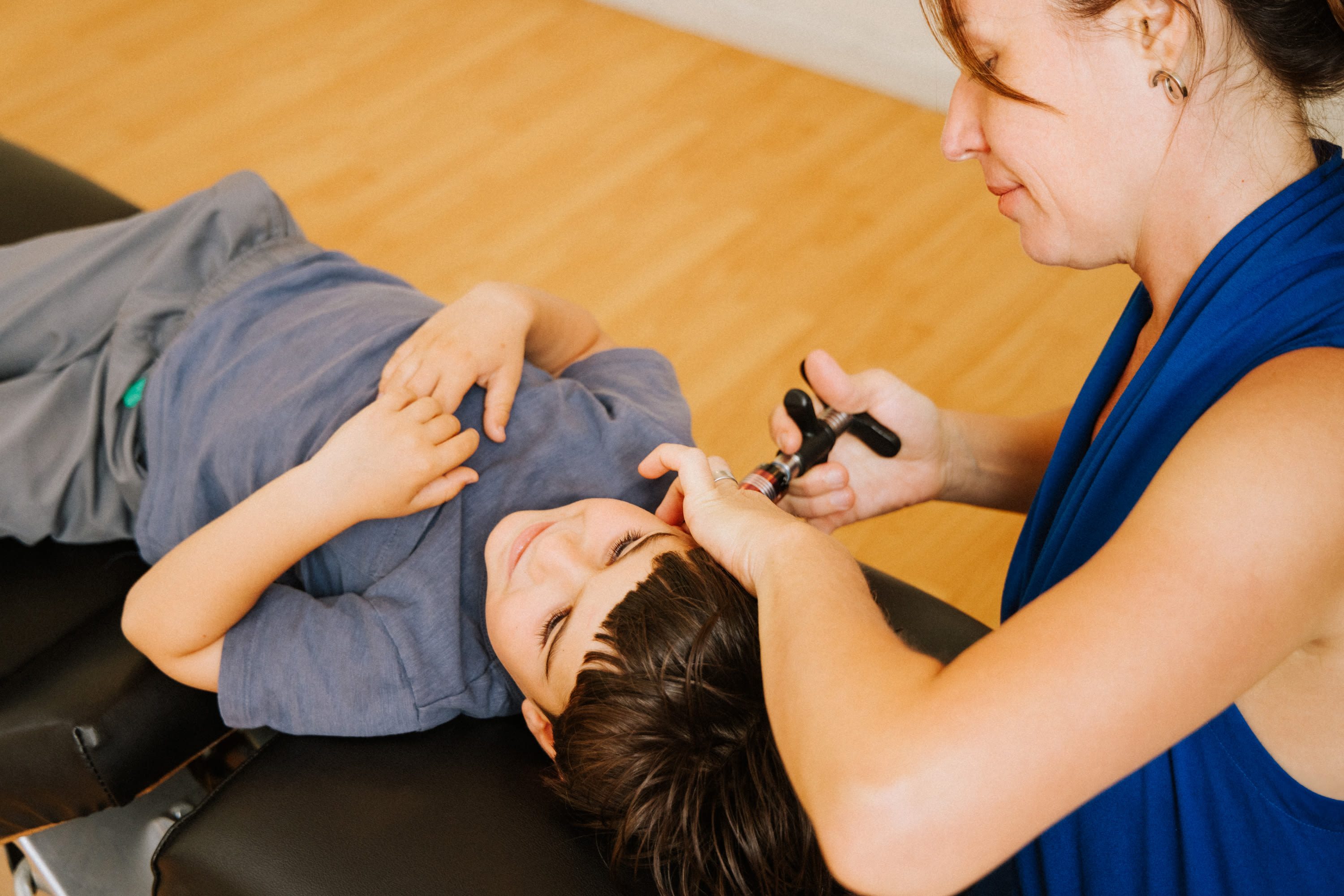 Happy child during chiropractic visit at The Shift Chiropractic in Oakland