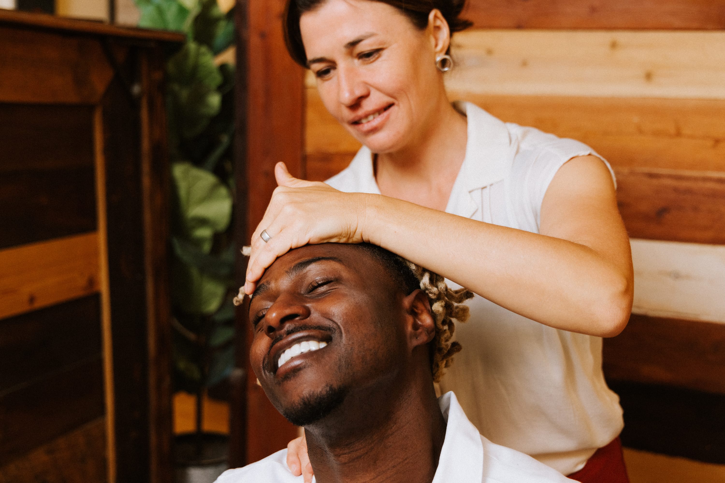 Gentle cranial chiropractic work by Dr. Irina Velichko at The Shift Chiropractic, calm light-touch treatment on patient's head in Oakland clinic