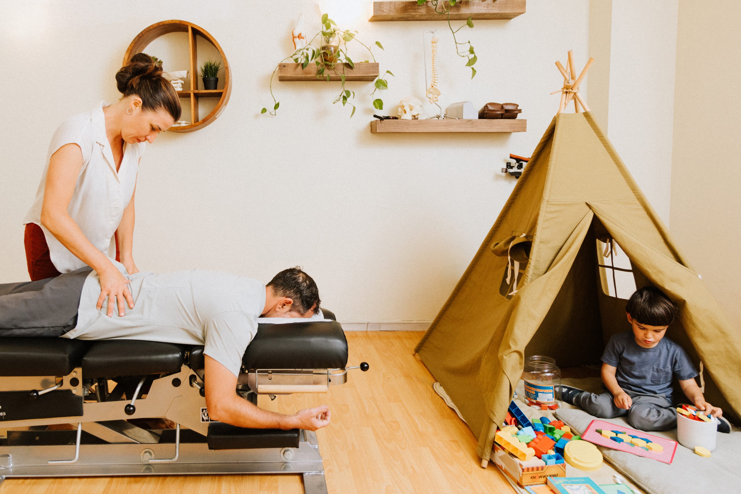 Chiropractor adjusting patient
