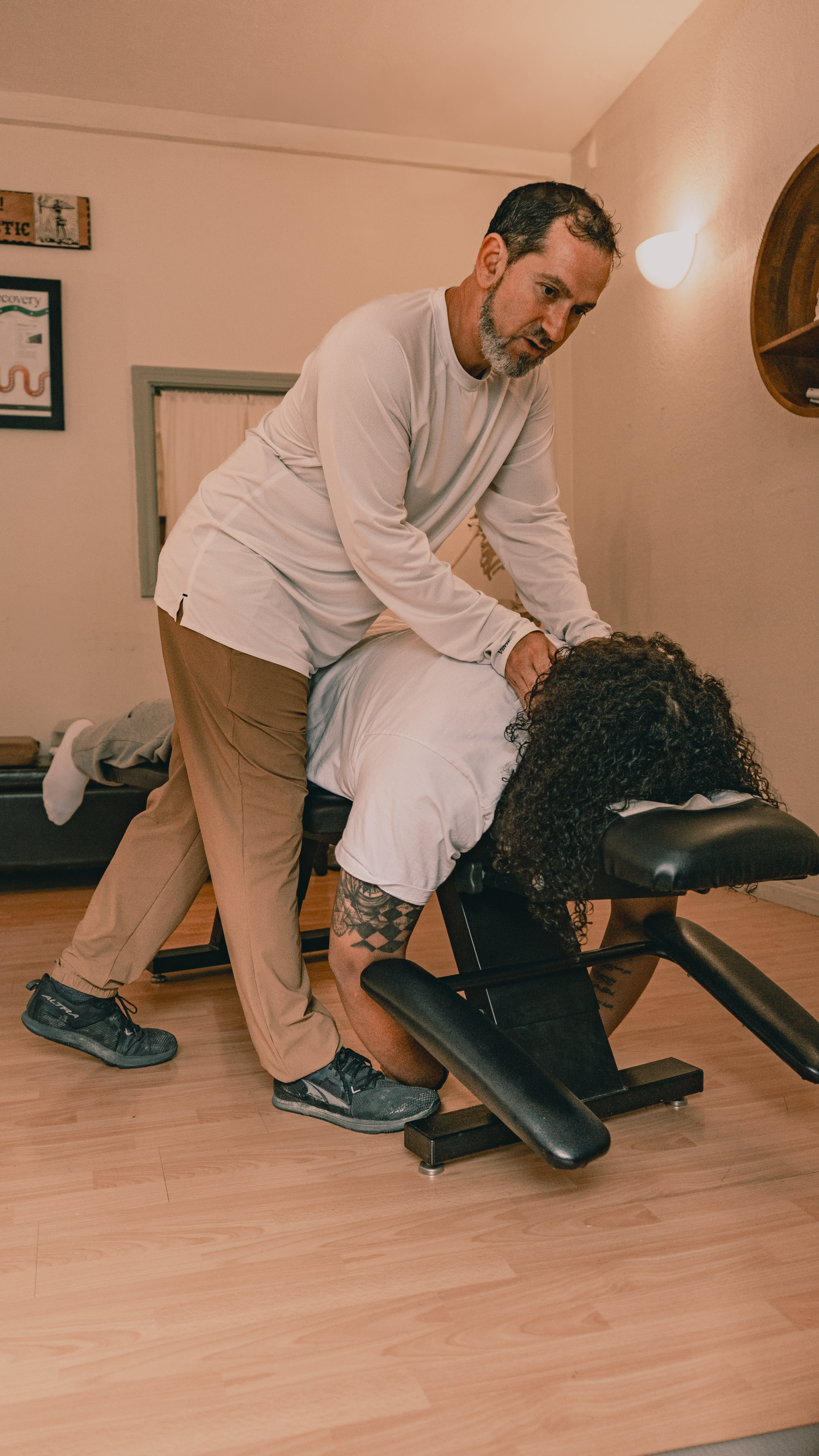 Dr. Ben Glass performing chiropractic adjustment to relieve back pain at The Shift Chiropractic in Oakland