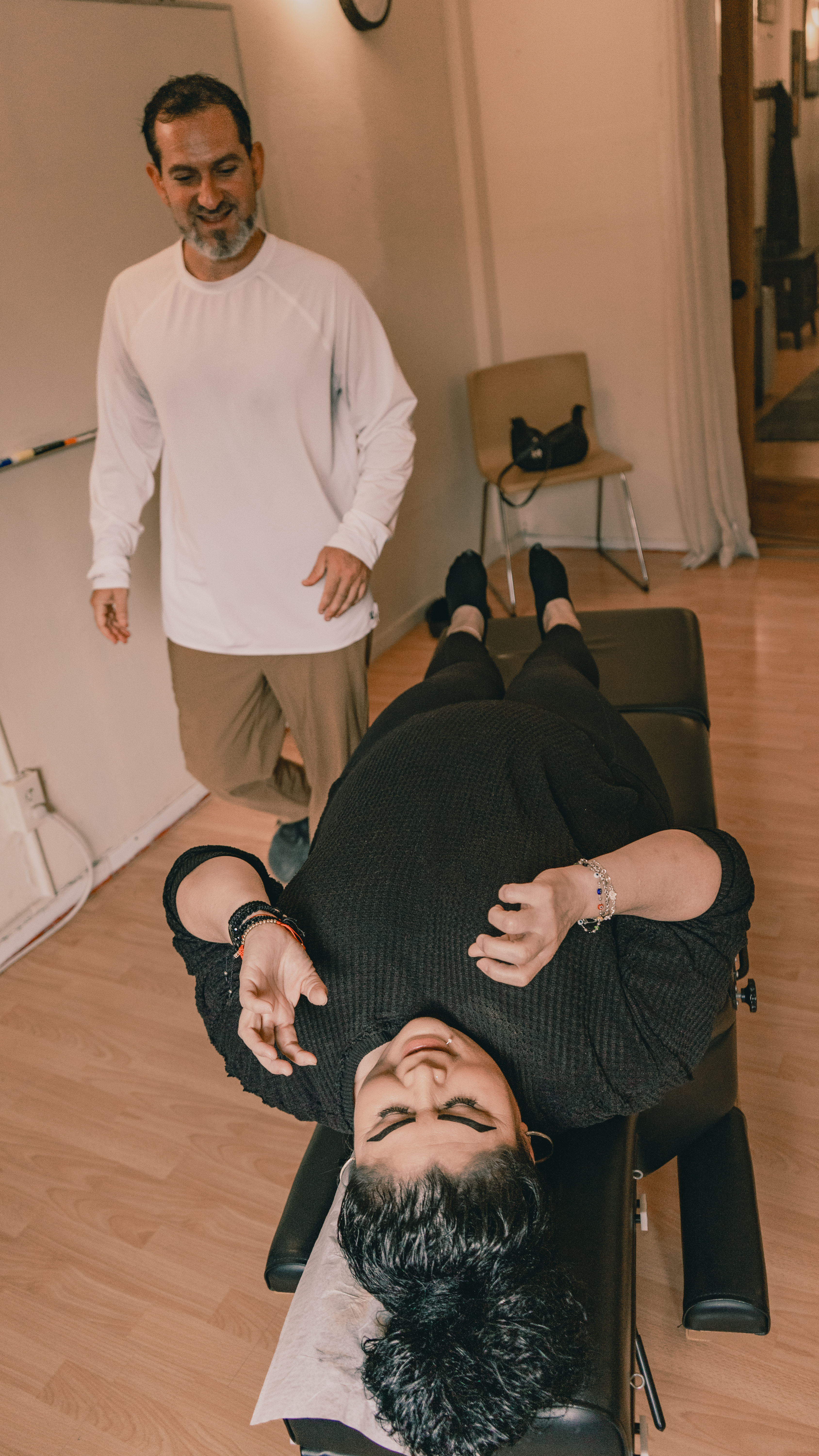 Chiropractor performing spinal adjustment to relieve back pain at The Shift Chiropractic in Oakland