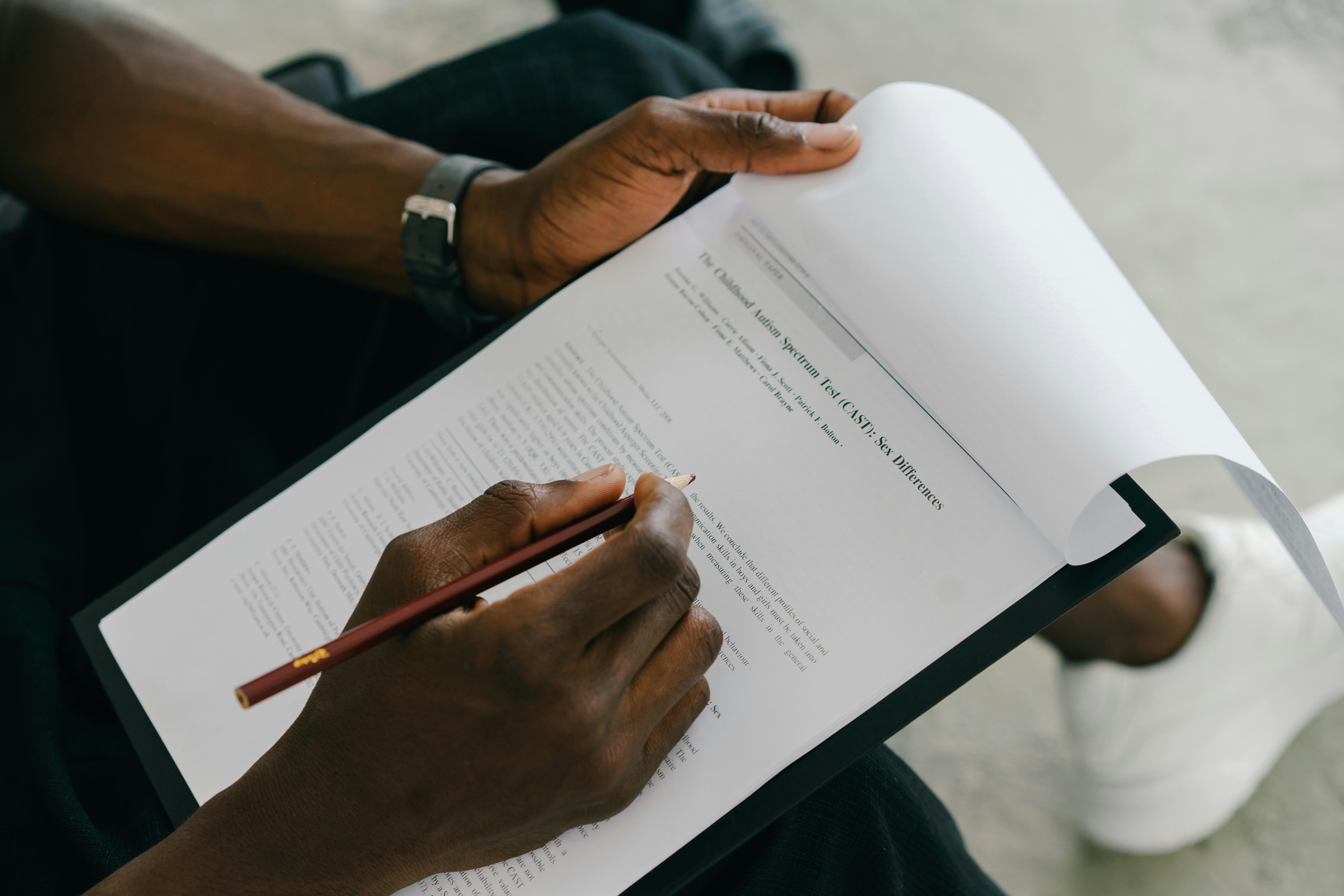 researcher writing a concise visual brief before generating graphical abstract concepts with AI