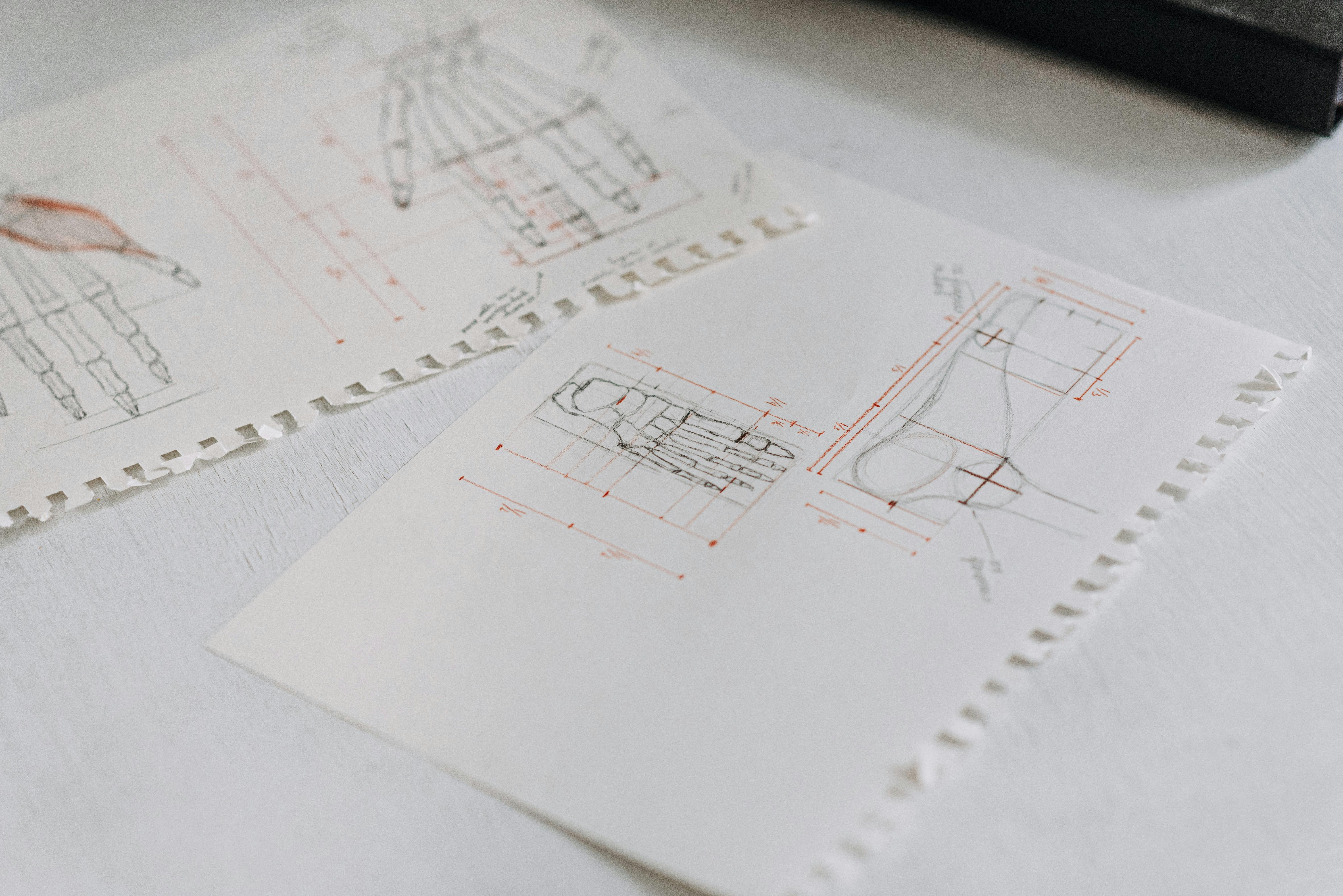 Hand-drawn sketches showing different layout options for a graphical abstract, with annotations and flow arrows indicating the progression from concept to visual structure