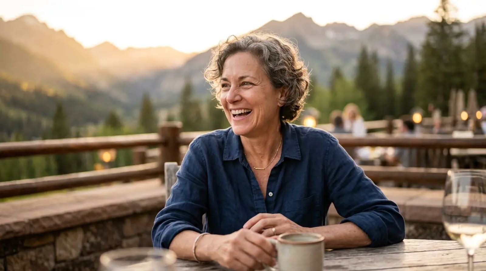 American traveler on luxury resort mountain terrace at golden hour experiencing travel discovery for points transfer bonuses