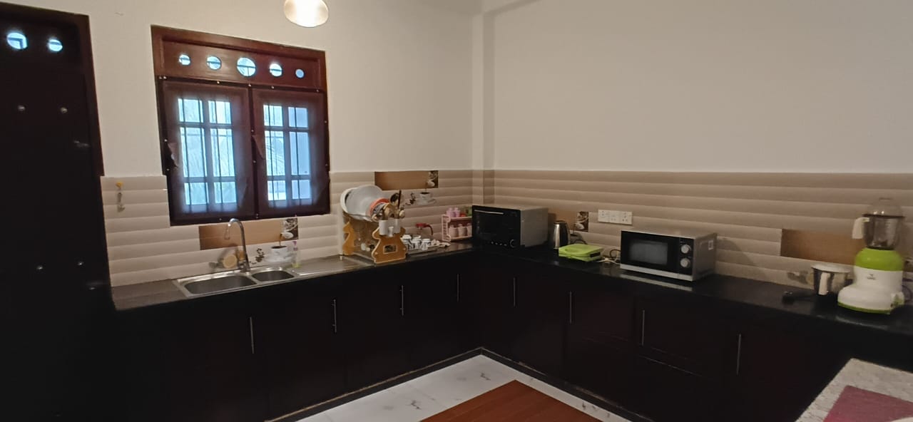 Pantry storage and workspace at Karapitiya Home Stay Apartment