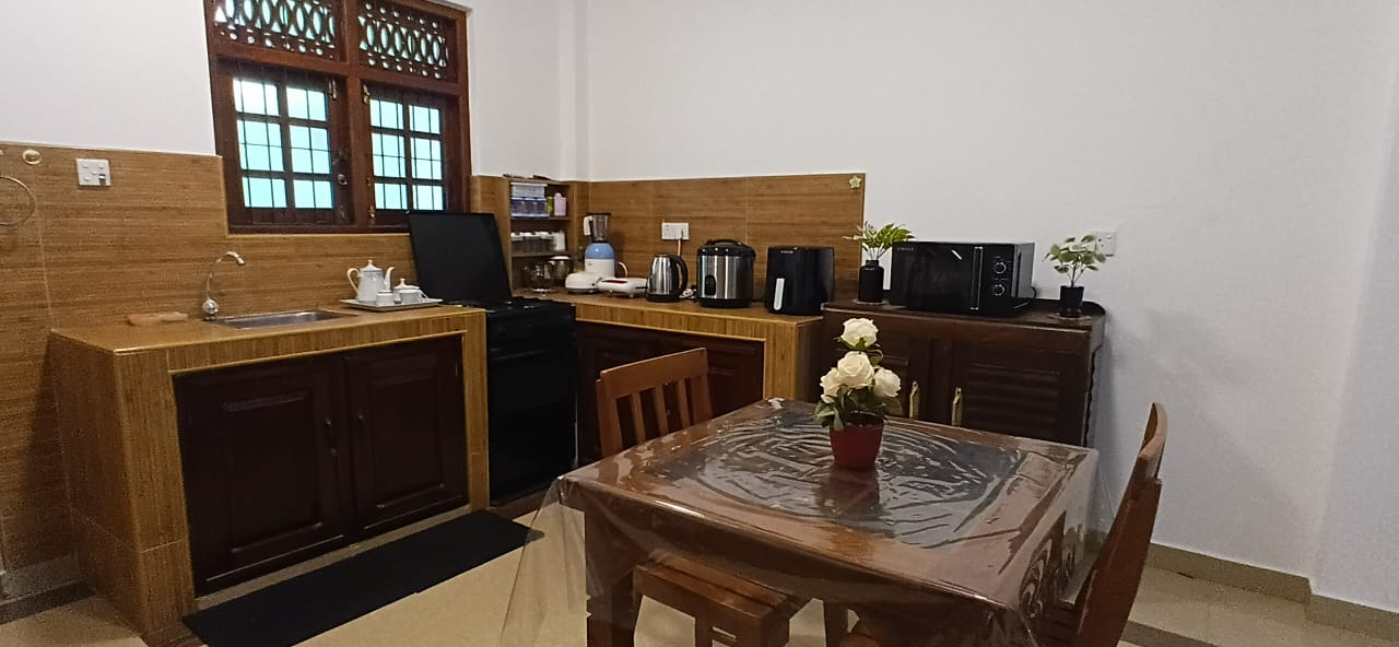 Fully equipped modern kitchen with appliances at Karapitiya student accommodation