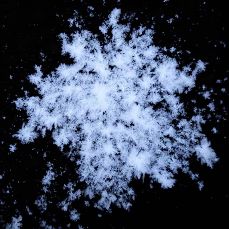 Image: A patch of white frost and ice crystals on a pure 