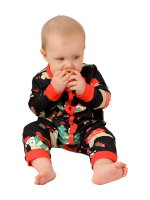 Julgråsuggor som hänger i kransarna, hela familjen i matchande pyjamas