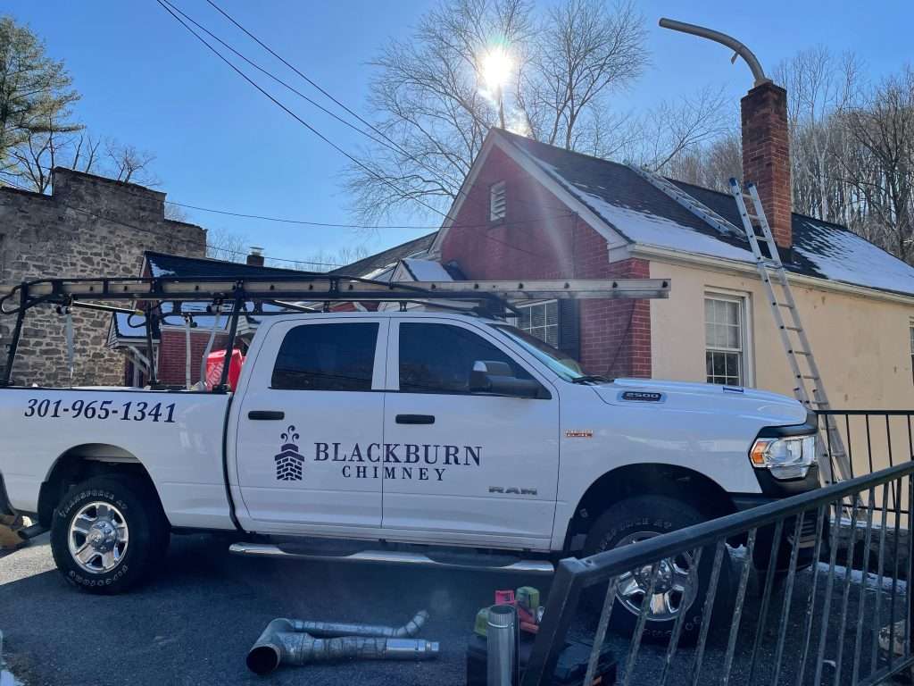 Chimney liner installation service in progress
