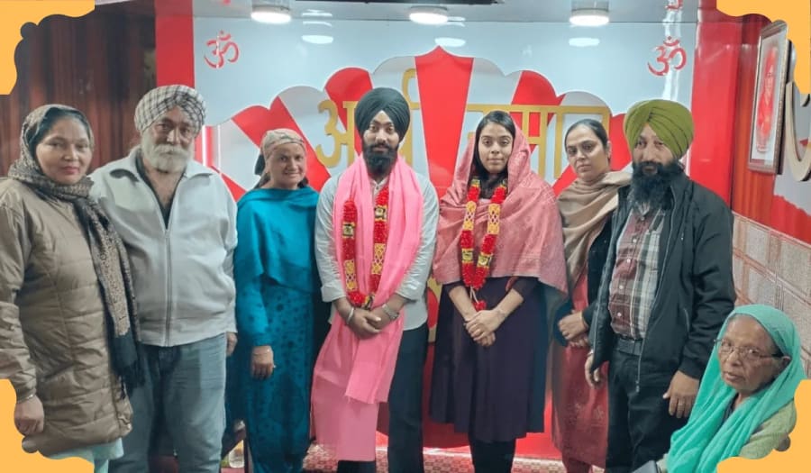 Newly registered couple holding their marriage certificate