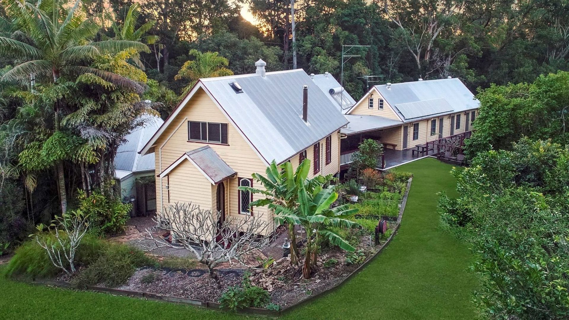 This lovingly restored property in the World Heritage-listed Glass House Mountains, also comes with repurposed train carriages. The seven-bedroom home is at 198 Barrs Road, Glass House Mountains QLD.