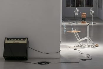 Photo of art installation of domas van wijk at art space Can Felipa, with guitar amp and chair. 