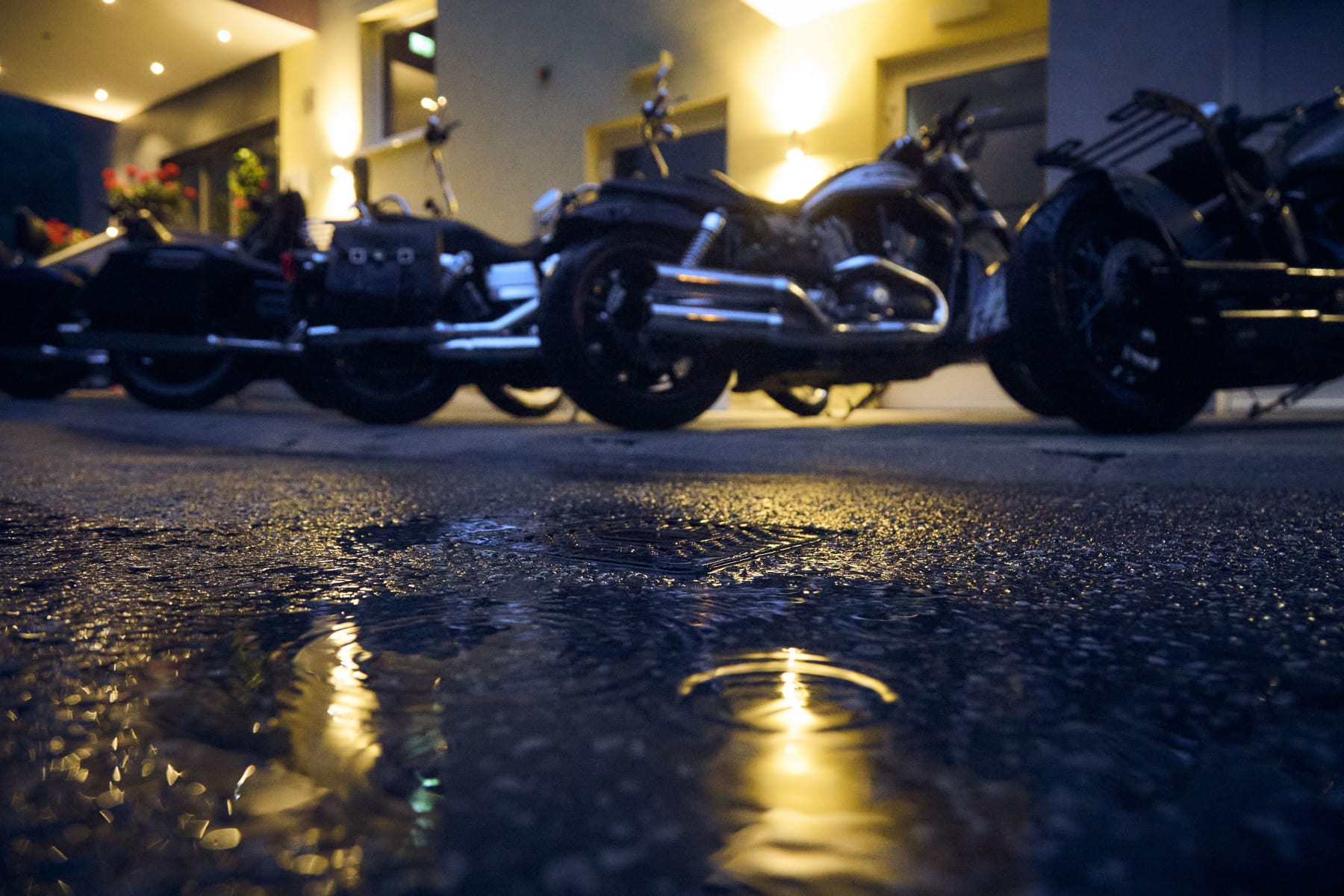 After rain, the ground shines under the lights of Glemmtalerhof in Hinterglemm.