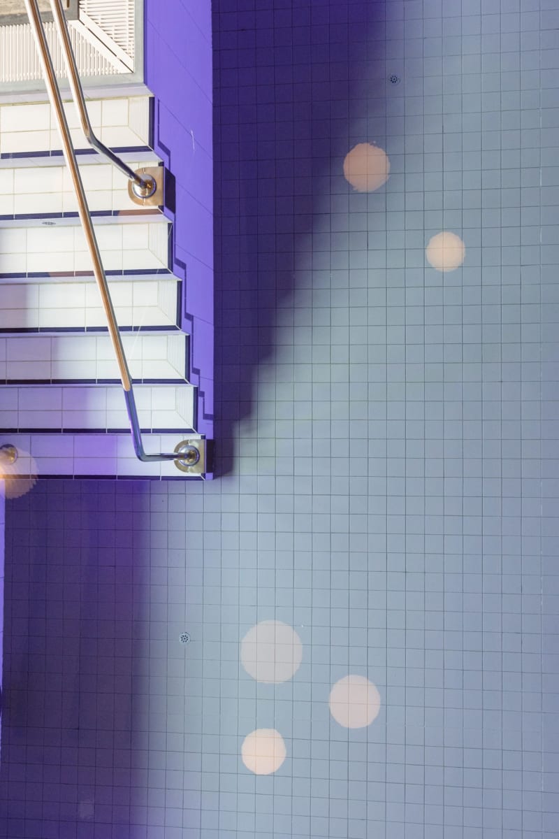 Shimmering pool in Glemmtalerhof, with beautiful tiles and atmospheric light.
