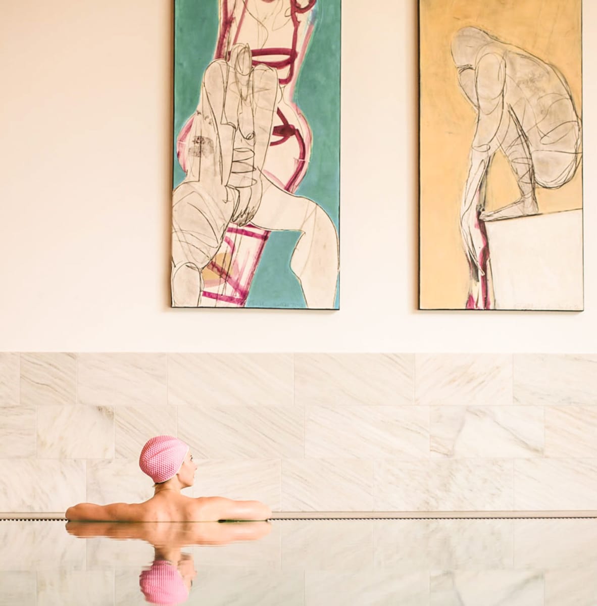 Guests relax at Glemmtalerhof in Hinterglemm, surrounded by modern art and water.