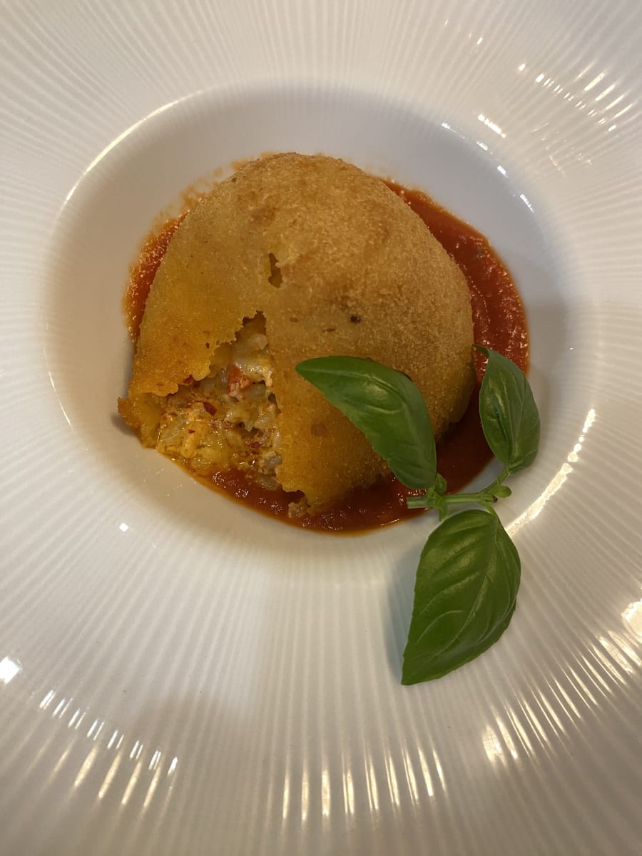 Etna-shaped arancino plated at home
