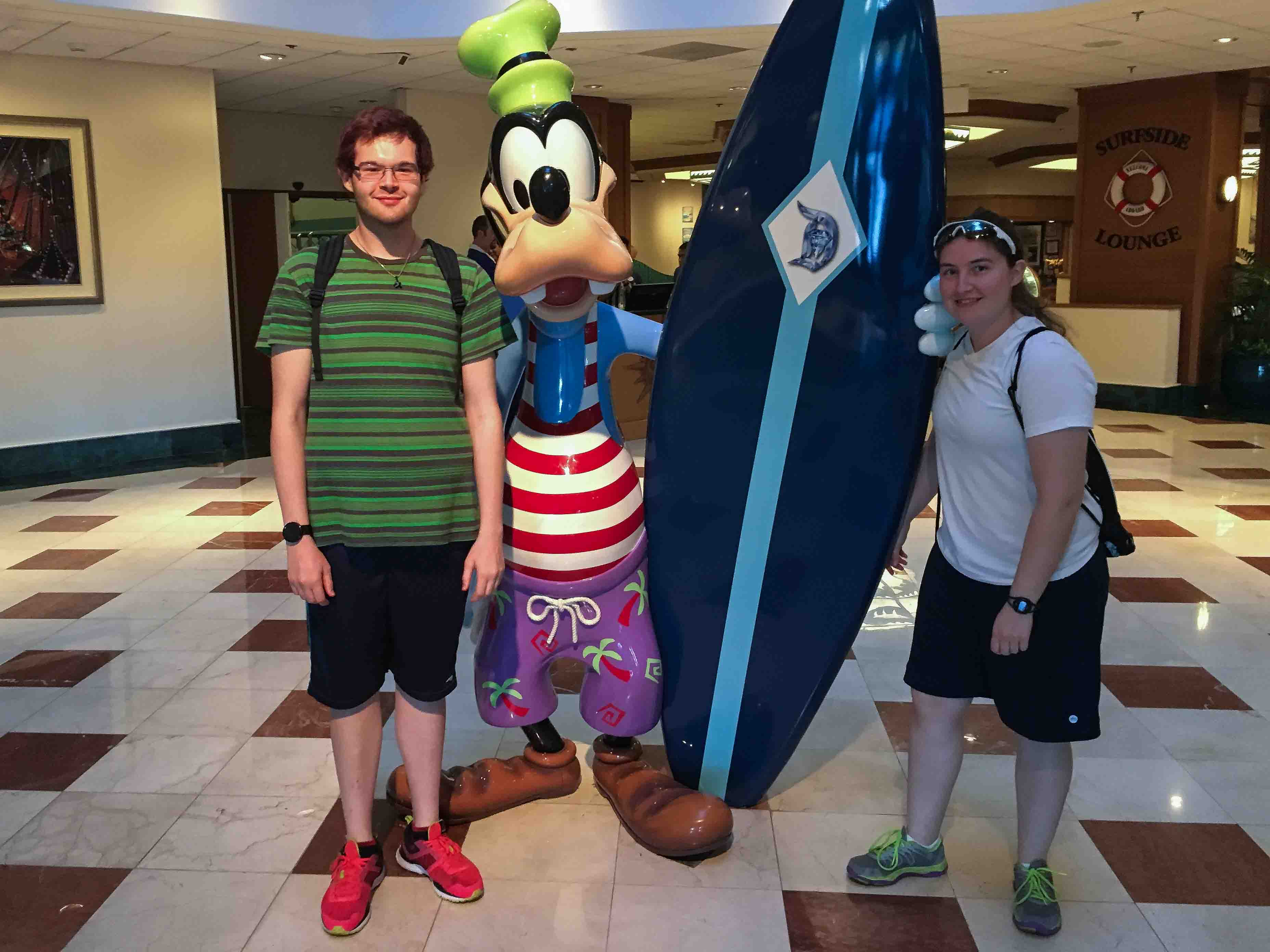 Donald and Brittany with Goofy and a surfboard