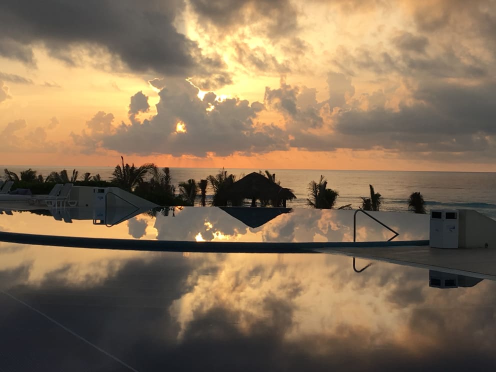 Cancun infinity pool at sunset