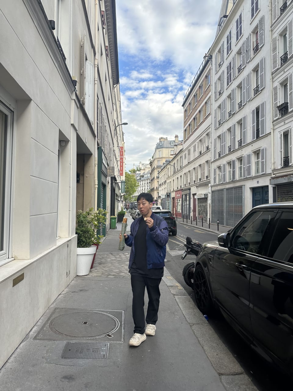 Eating a baguette on the streets of Paris