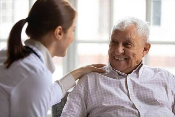 A friendly doctor consulting with a senior patient.