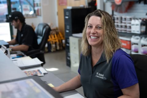 Bobcat Dealer Smiles For A Photo At Bobcat Dealership