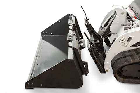 Studio close up demonstrating Bob-Tach mounting system with Bobcat MT100 mini track loader attaching to bucket attachment