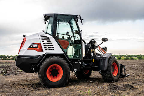 Bobcat L85 Compact Wheel Loader Turns To the Left On Dirt Jobsite.