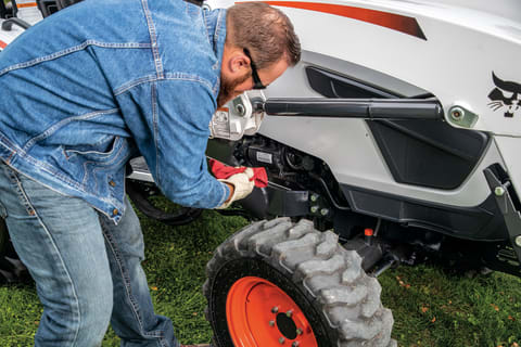 Acreage Owner Checks Bobcat Compact Tractor Oil