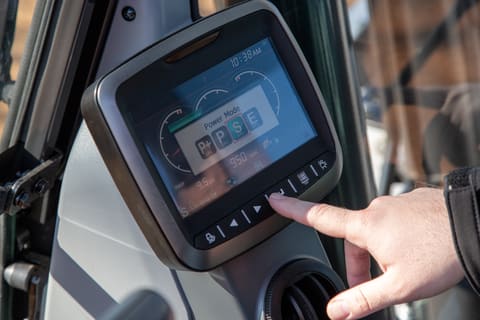 Close Up Of Operator Selecting A Power Mode On A Bobcat E145 Large Excavator Control Panel