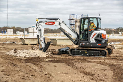 Operator Digs With Bucket Attachment On Bobcat R2 Series Mini Excavator