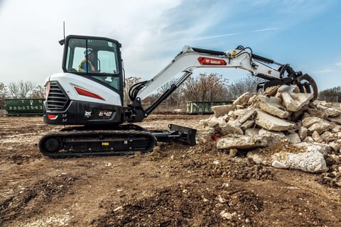 Customer Using Bobcat Mini Excavator To Move Large Material