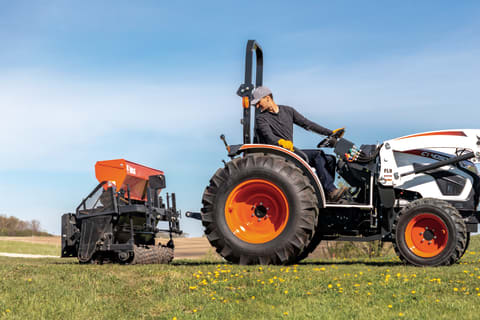  Operator Backing A Bobcat CT4050 Compact Tractor To The Seeder Attachment