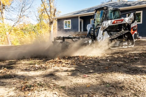 T66 loader with soil conditioner attachment 