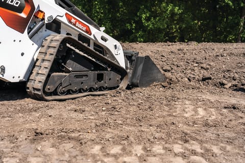 Bobcat MT100 mini track loader on dirt.