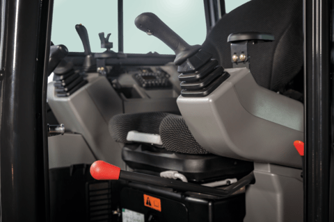 Bobcat compact (mini) excavator seat and joystick controls.