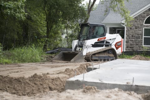 Bobcat T550 Grading Driveway On Residential Construction Site