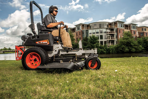 An Operator Cuts Grass in a Commercial Lot With the Bobcat ZT3500 Zero-Turn Mower