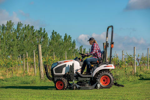 Mid-PTO Powered Mid-Mount Mower On Bobcat Compact Tractor Mowing Vineyard