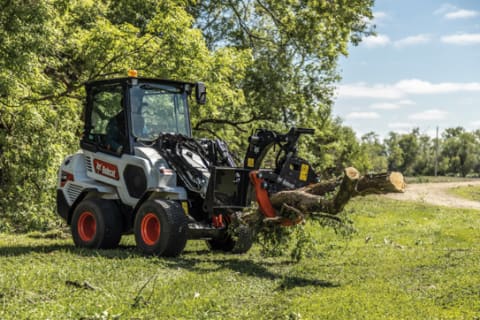  Bobcat L28 small articulated loader with log grapple attachment.