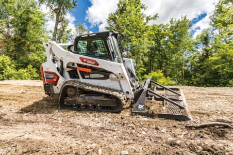 Bobcat T595 With Landplane Attachment Leveling Ground On Worksite