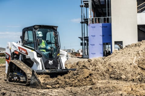 Bobcat T62 Compact Track Loader Pushing Dirt On A Construction Site