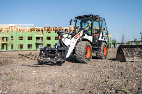 Bobcat L85 Compact Wheel Loader On A Jobsite Switching Between Attachments