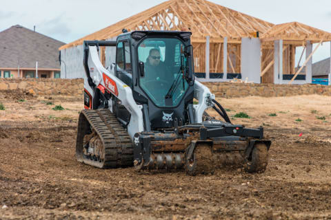 Operator Conditioning Soil With Bobcat Compact Track Loader