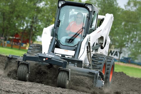 Bobcat Skid-Steer Loader with soil conditioner attachment