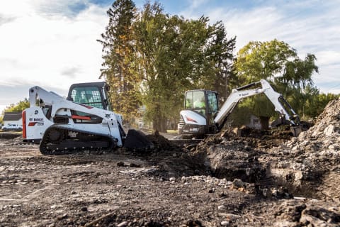 A Bobcat Compact Track Loader And Compact Excavator Working Together On A Jobsite