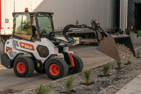 Operator Uses an L28 Small Articulated Loader to Place Landscape Rock 